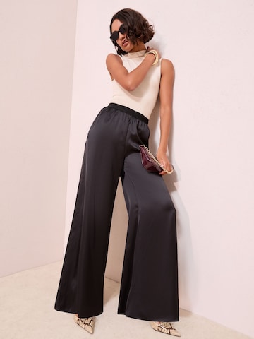 Friends Like These Szeroka nogawka Spodnie w kolorze czarny: przód