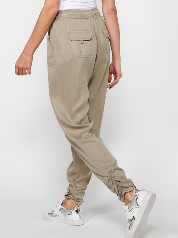 Loosefit Pantaloni sportivi di KOROSHI in grigio