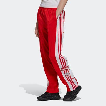 ADIDAS ORIGINALS Loose fit Trousers in Red: front