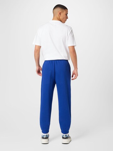 Champion Authentic Athletic Apparel Ozke Športne hlače | modra barva