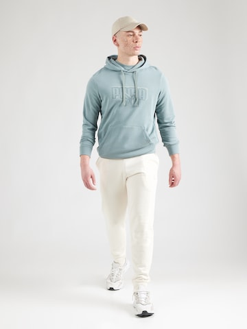 PUMA Sport sweatshirt 'ESS' i grön