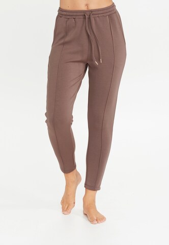 Athlecia Skinny Workout Pants 'Jacey' in Brown: front