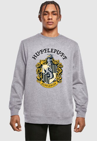 ABSOLUTE CULT Sweatshirt 'Harry Potter - Hufflepuff Crest' in Grijs: voorkant