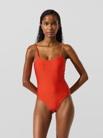 Costume intero di Karl Lagerfeld in arancione: frontale