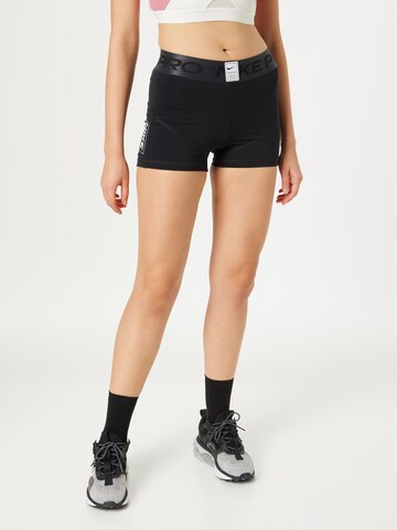 Skinny Pantaloni sport de la NIKE pe negru: față