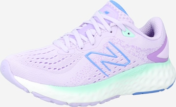 Chaussure de course new balance en violet : devant