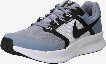 Chaussure de course NIKE en bleu : devant