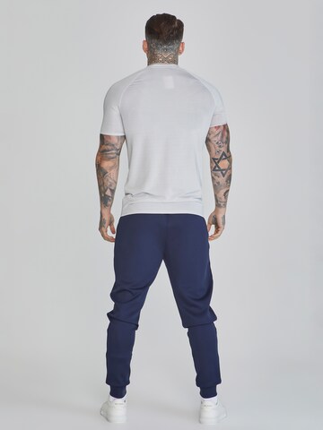 Tapered Pantaloni sportivi di SikSilk in blu