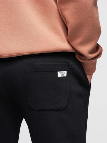 Effilé Pantalon de sport Ombre en noir