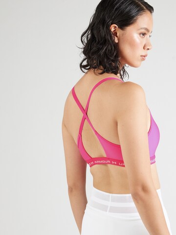 UNDER ARMOUR Bustier Biustonosz sportowy w kolorze różowy