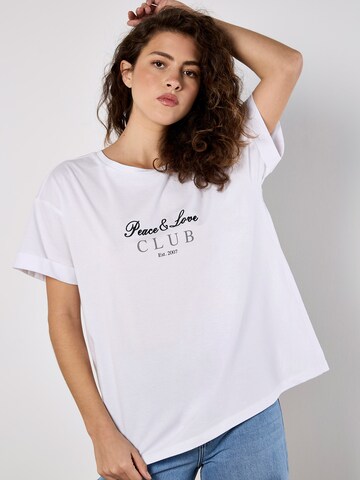 Haut Apricot en blanc