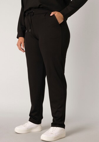 BASE LEVEL CURVY Regular Pleat-Front Pants in Black