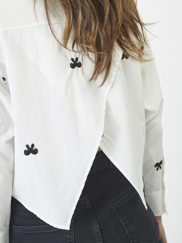 Chemisier 'Ria' co'couture en blanc