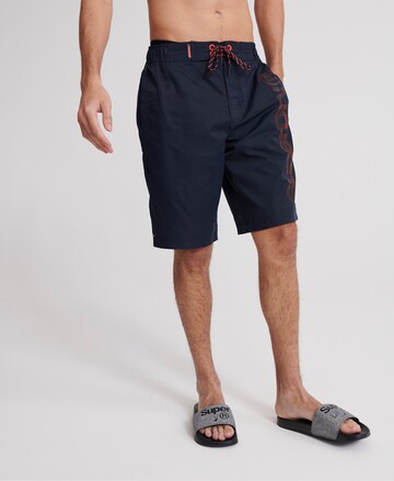 Superdry Skinny Board Shorts in Blue: front