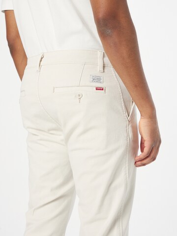 Tapered Pantaloni eleganți 'XX Chino Standard' de la LEVI'S ® pe bej