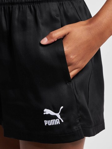 PUMA Lużny krój Spodnie 'T7' w kolorze czarny