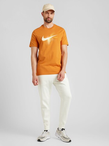 Tapered Pantaloni 'Club Fleece' de la Nike Sportswear pe bej