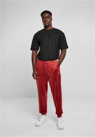 Loosefit Pantaloni di Karl Kani in rosso