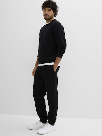 Effilé Pantalon bonprix en noir