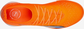 PUMA Soccer Cleats in Orange