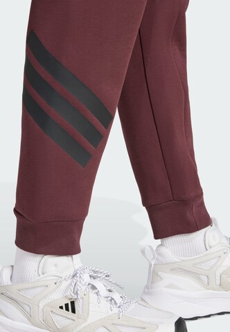 ADIDAS SPORTSWEAR Tapered Sports trousers 'Future Icons' in Red