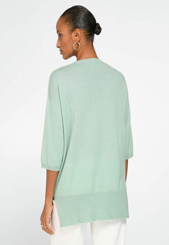 Pull-over include en vert