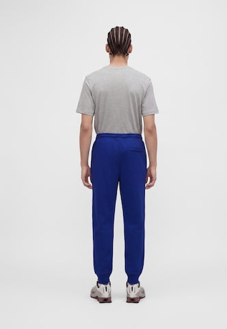 Nike Sportswear Tapered Housut 'CLUB' värissä sininen