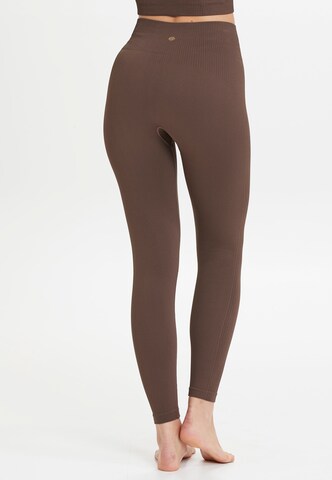 Athlecia Skinny Workout Pants 'Flow' in Brown