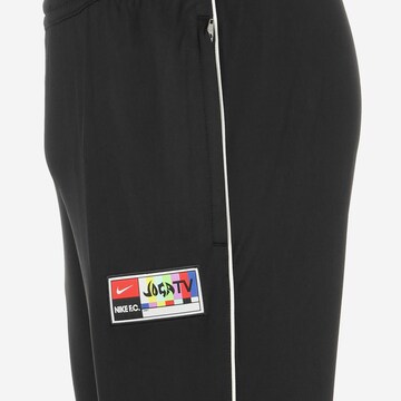 Effilé Pantalon de sport NIKE en noir