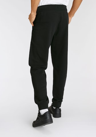 Champion Authentic Athletic Apparel Tapered Hose in Schwarz