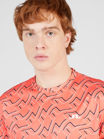 J.Lindeberg - Camiseta funcional 'Ade' en naranja
