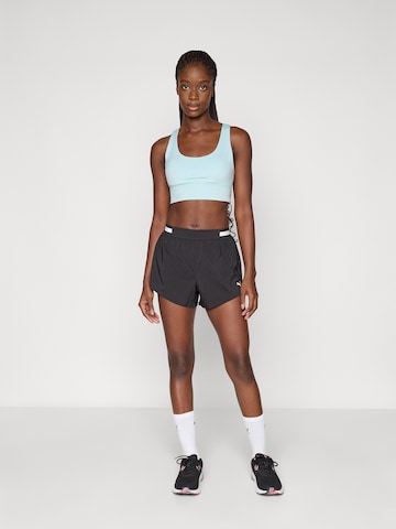 PUMA Regular Sportshorts 'Floral Ribbo' in Schwarz