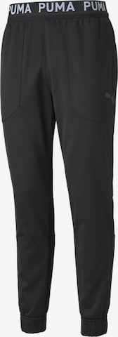 PUMA Tapered Workout Pants in Black: front