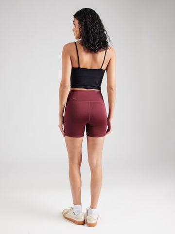 PUMA Skinny Sportnadrágok 'TAD Essential' - piros