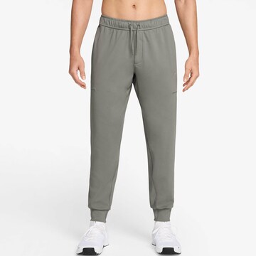 NIKE Tapered Workout Pants in Green: front