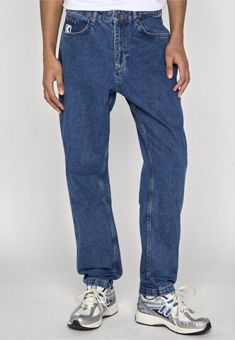 Karl Kani Tapered Jeans in Blue: front