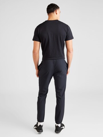 UNDER ARMOUR Tapered Sportsbukser i sort