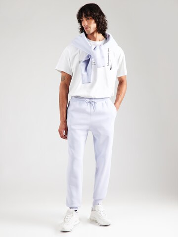 Nike Sportswear Tapered Housut 'CLUB' värissä sininen