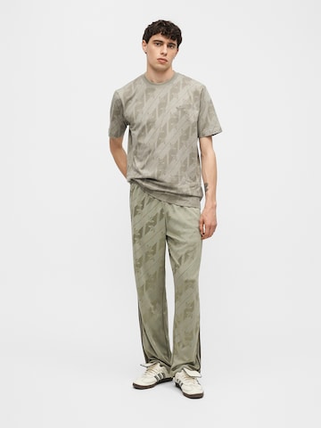 ADIDAS ORIGINALS - Pierna ancha Pantalón 'Firebird' en verde