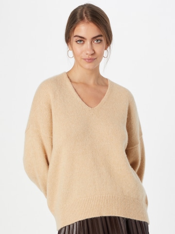 Pull-over BOSS Orange en beige : devant