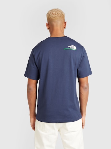 THE NORTH FACE T-shirt 'EST 1966' i blå