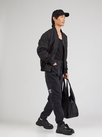 Karl Kani Tapered Jeans in Black