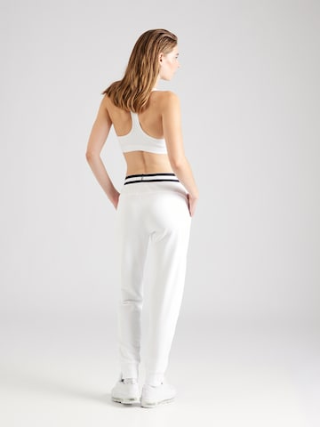 Effilé Pantalon de sport NIKE en blanc