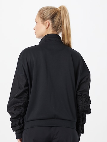 Reebok Sports sweat jacket in Black