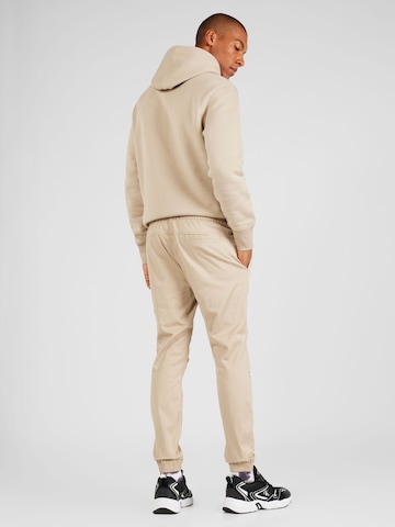 Tapered Pantaloni chino di Calvin Klein Jeans in beige
