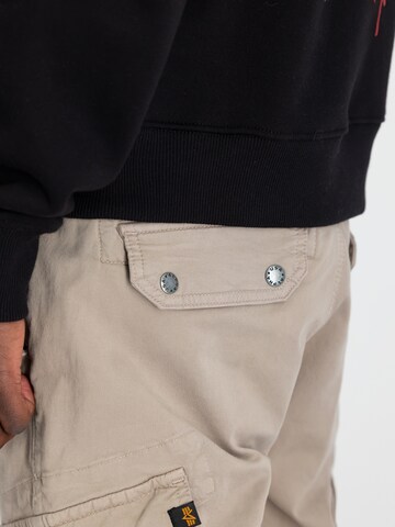 ALPHA INDUSTRIES Tapered Cargo nadrágok 'Combat' - bézs