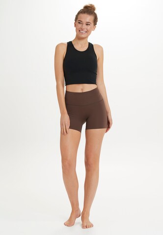 Athlecia Slimfit Sportbroek ' ALMY ' in Bruin