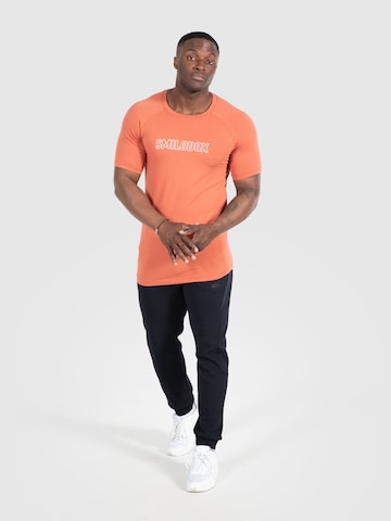 T-Shirt fonctionnel 'Timmy' Smilodox en orange