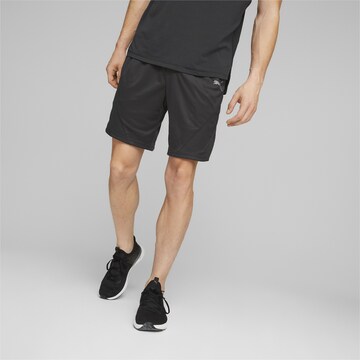 PUMA Regular Sports trousers in Black: front