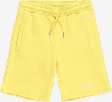 Pantaloni di Calvin Klein Jeans in giallo: frontale